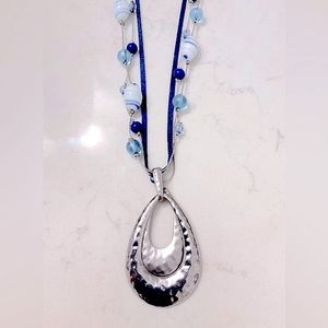 Silver-tone hammered metal teardrop shaped pendant